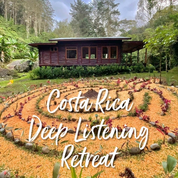 Costa Rica Deep Listening Retreat: A spiral path with red flowers and stones winds toward a wooden cabin in a lush Costa Rican forest.