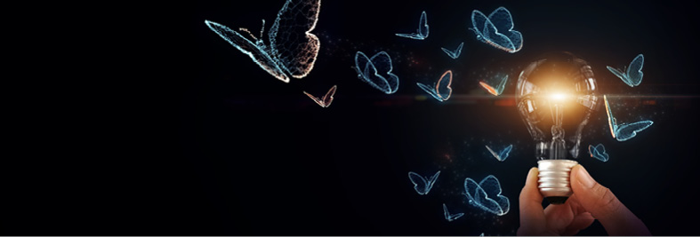 Human hand holds an illuminated lightbulb, releasing a swarm of radiant butterfly outlines into the deep, dark atmosphere.